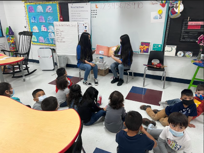 NJHS students reading to Elementary students 